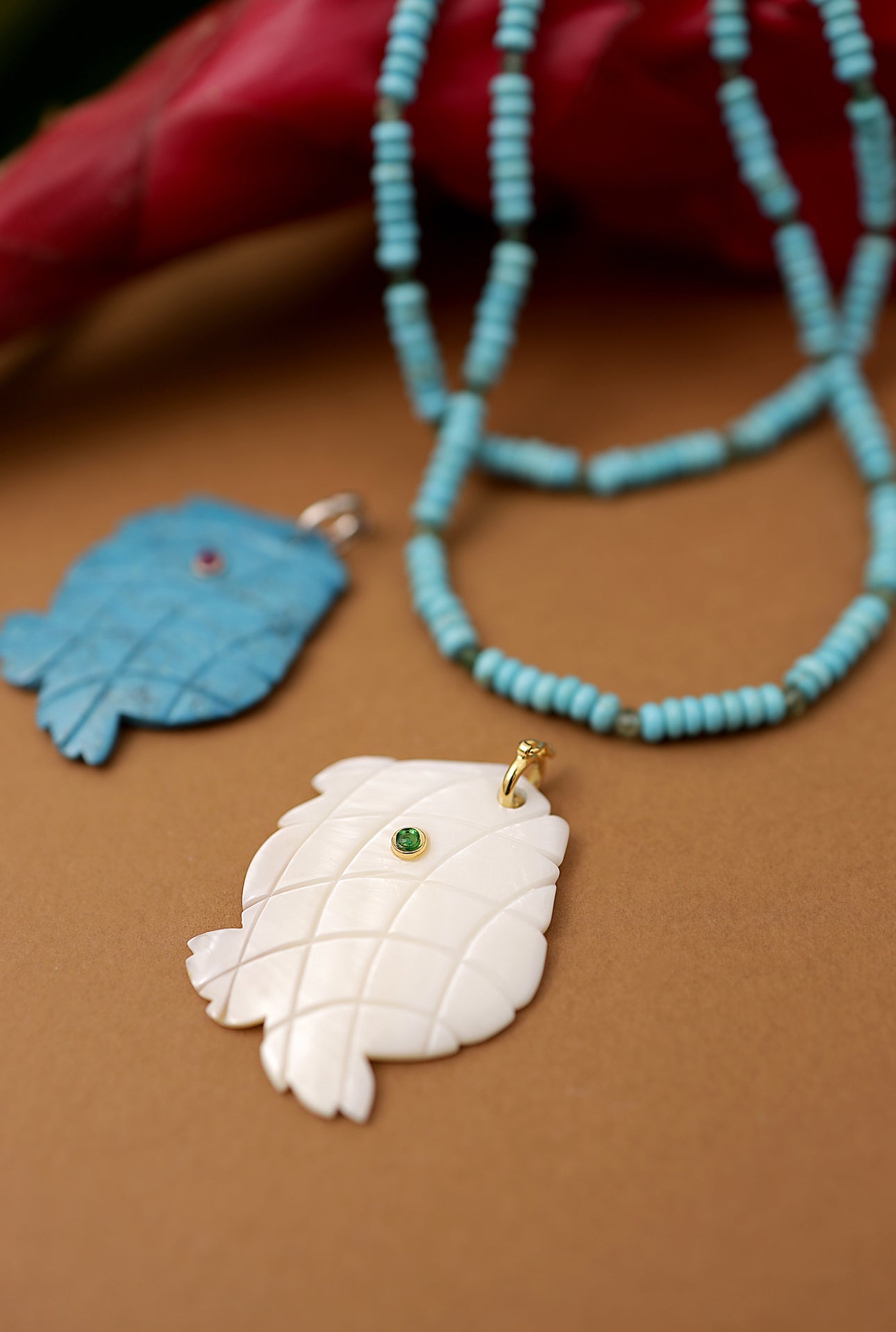 Mother-of-Pearl Fish Pendant with Green Gemstone Accent